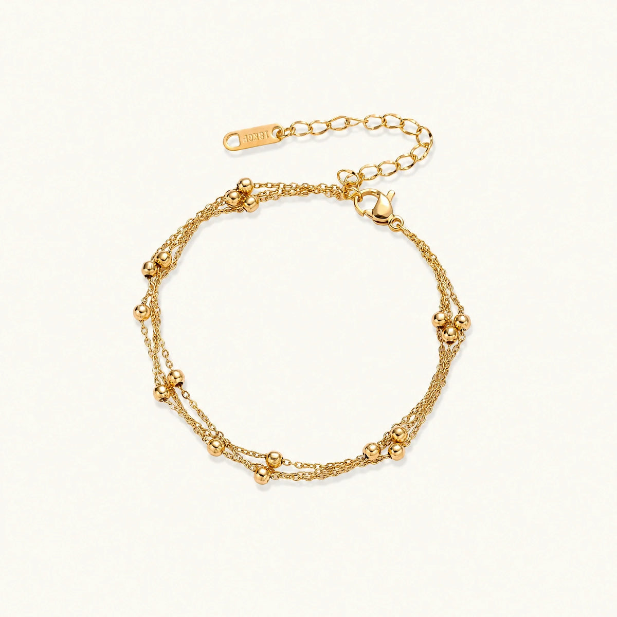 Golden Orbit Bracelet on a light background