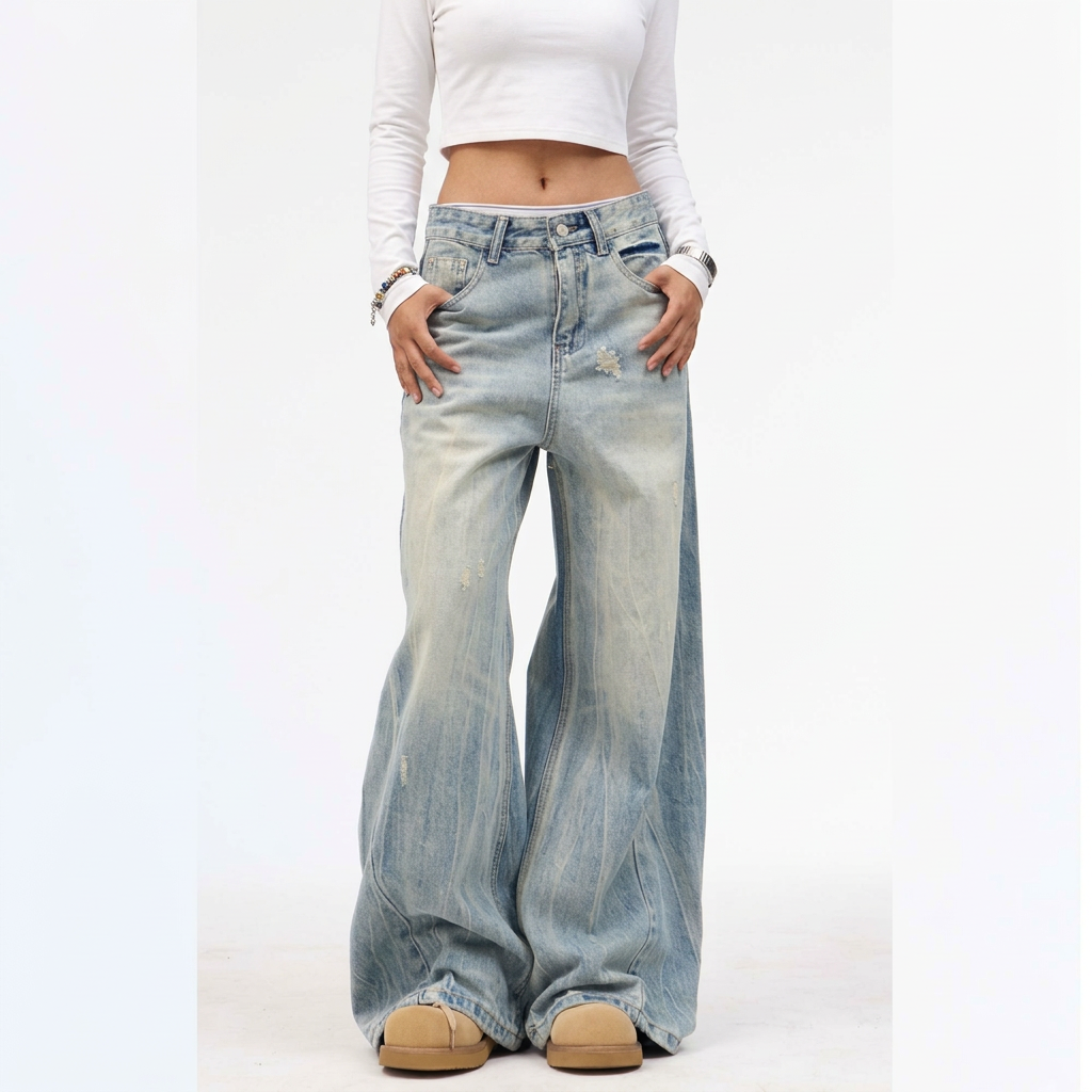 Washed blue wide-leg jeans styled with a white long-sleeve cropped top, front view