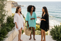 Three GaileneGrace models on a coastal terrace in Pareos Beach Kaftans